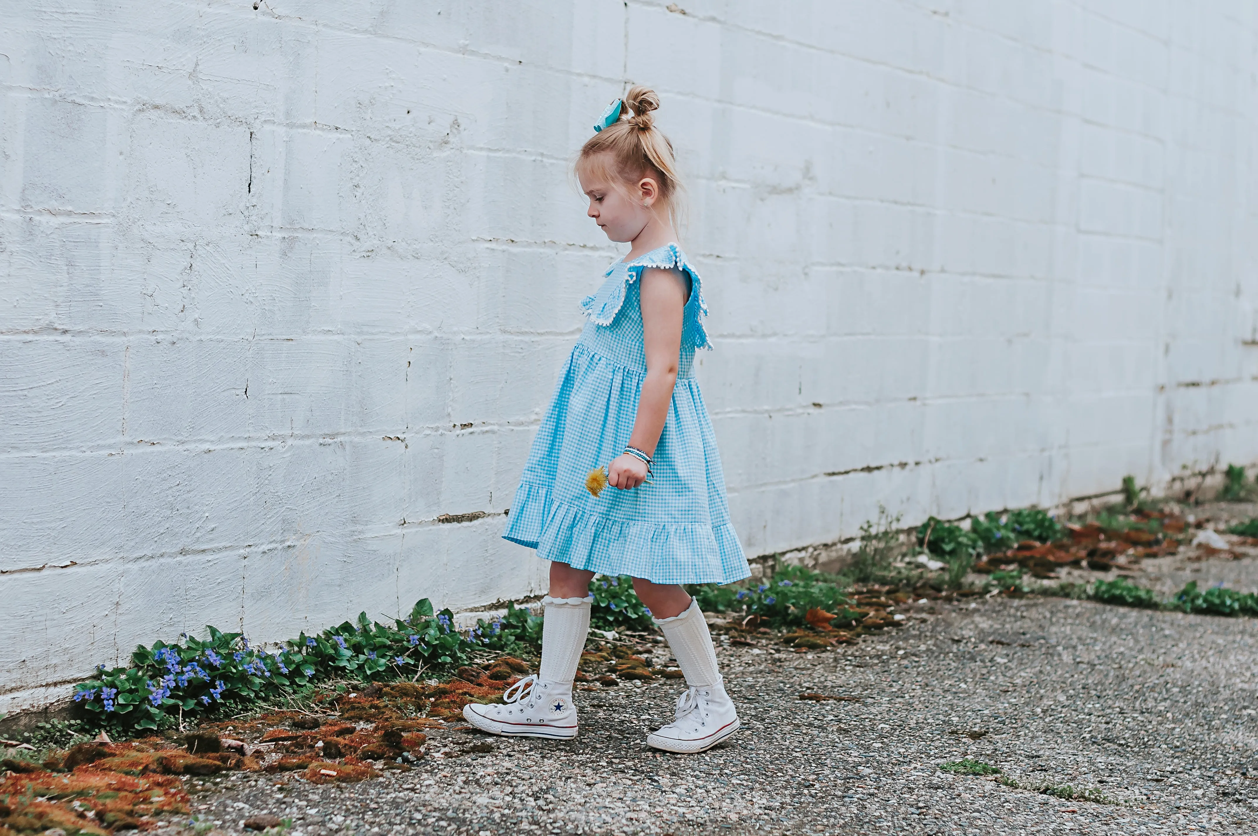 Little Girl's Blue Gingham Pinafore Dress with Pom Pom Trim