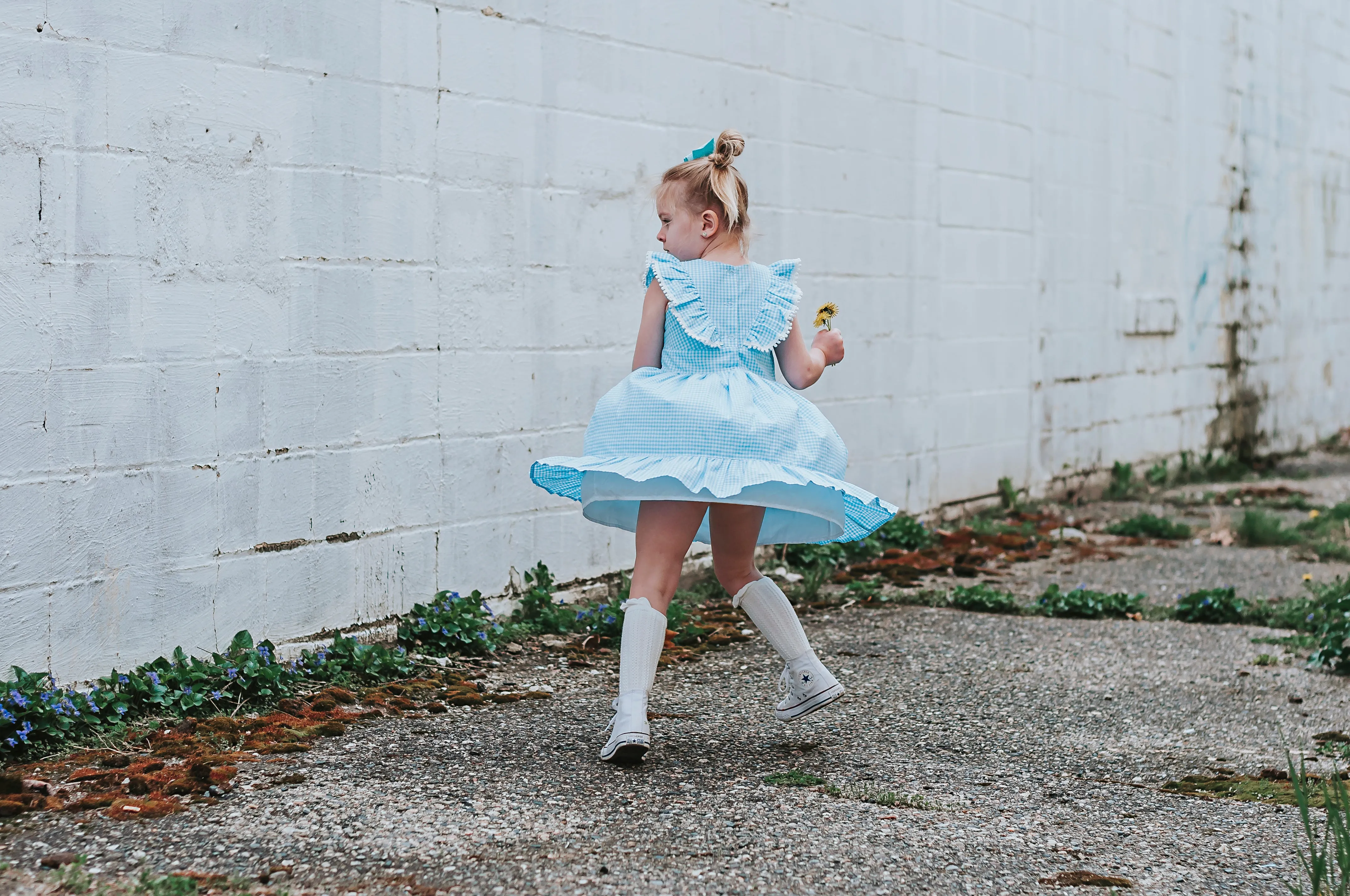 Little Girl's Blue Gingham Pinafore Dress with Pom Pom Trim
