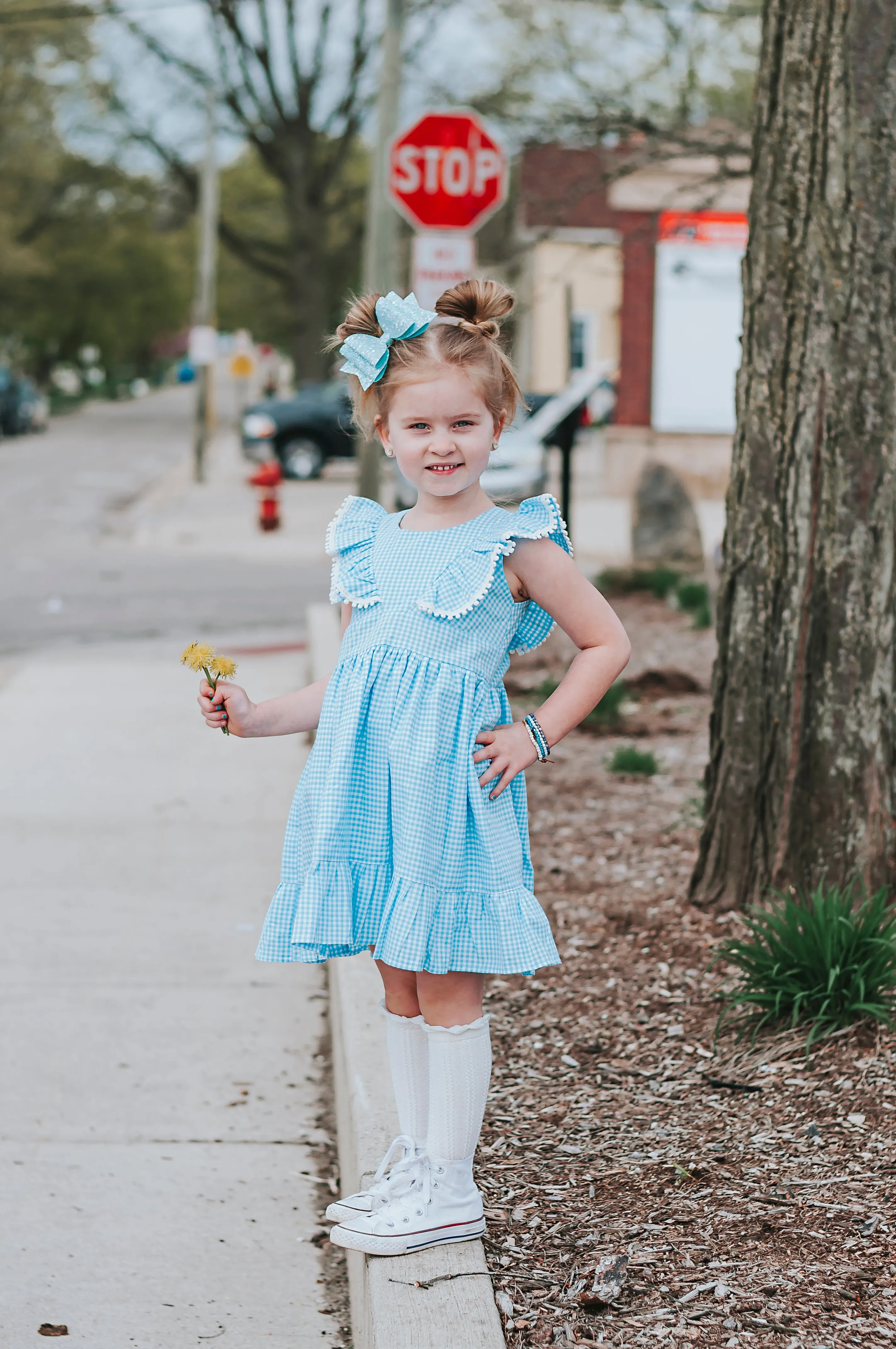 Little Girl's Blue Gingham Pinafore Dress with Pom Pom Trim