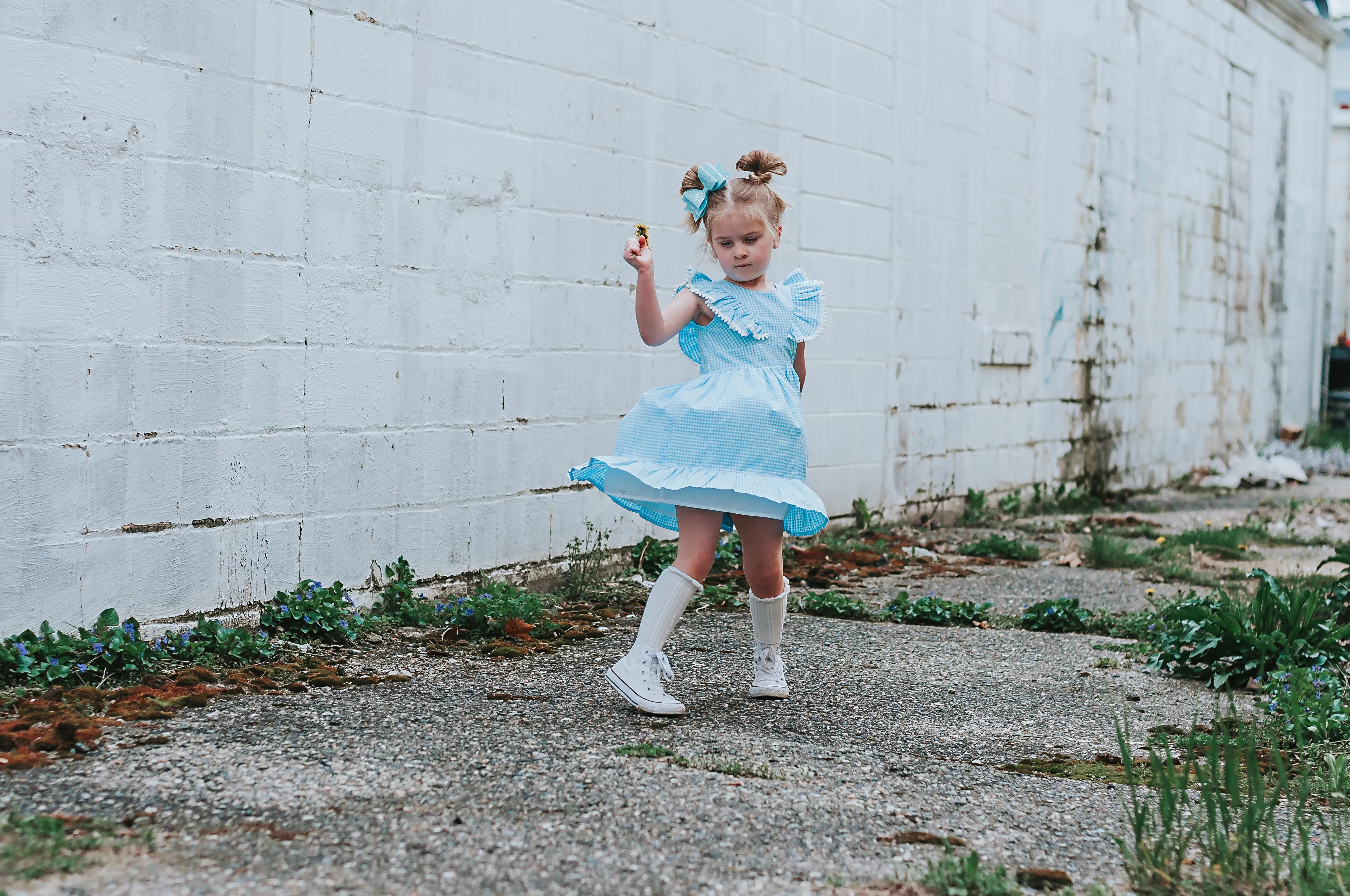 Little Girl's Blue Gingham Pinafore Dress with Pom Pom Trim